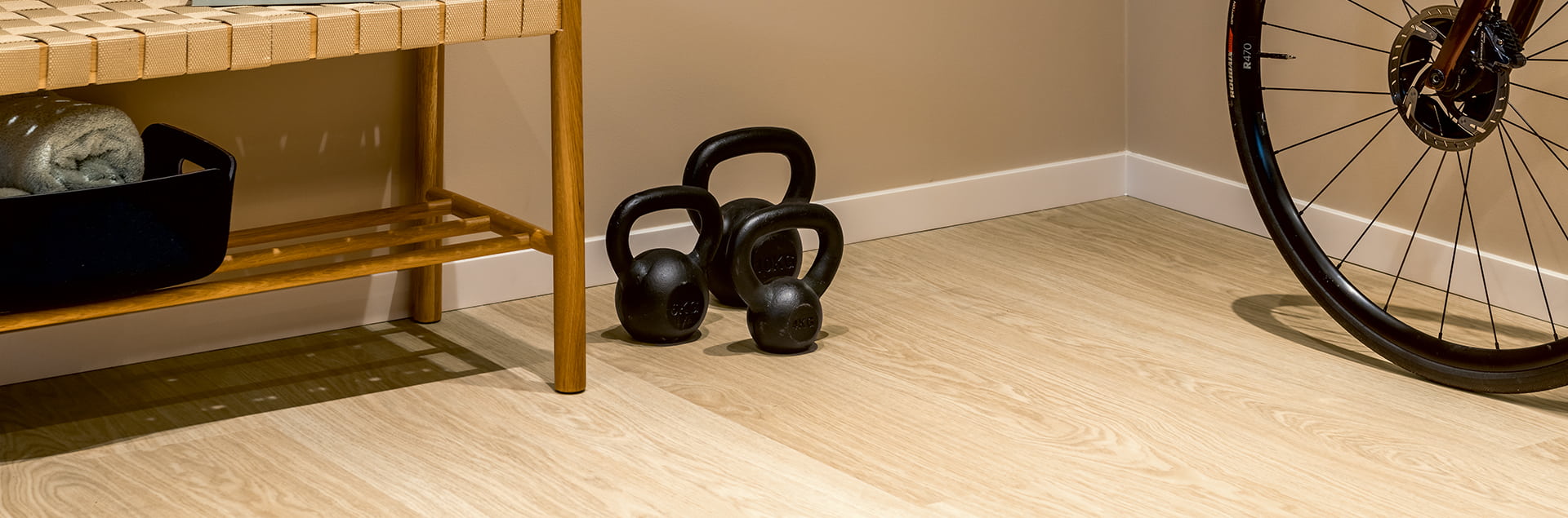 Dumbbells and gym equipment on the vinyl floor
