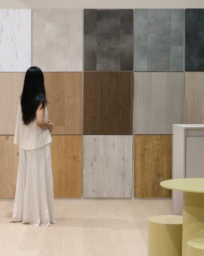Testing vinyl flooring barefoot in the Floor Xpert showroom Singapore — the most reliable way to assess LVT versus SPC comfort before buying